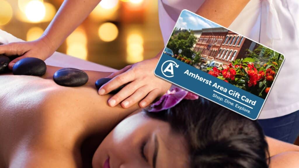 A woman getting a massage using her Amherst Area Gift Card. HINT: Check out Elements Hot Tub Spar.