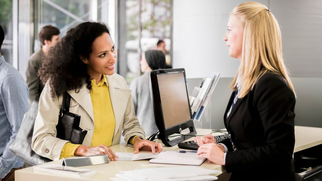 Woman talking to a bank teller