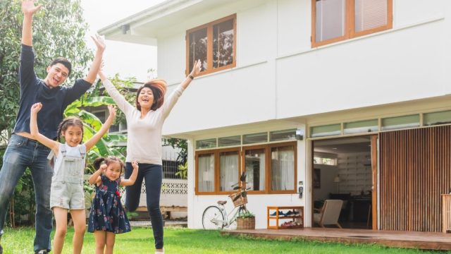 family infront of house