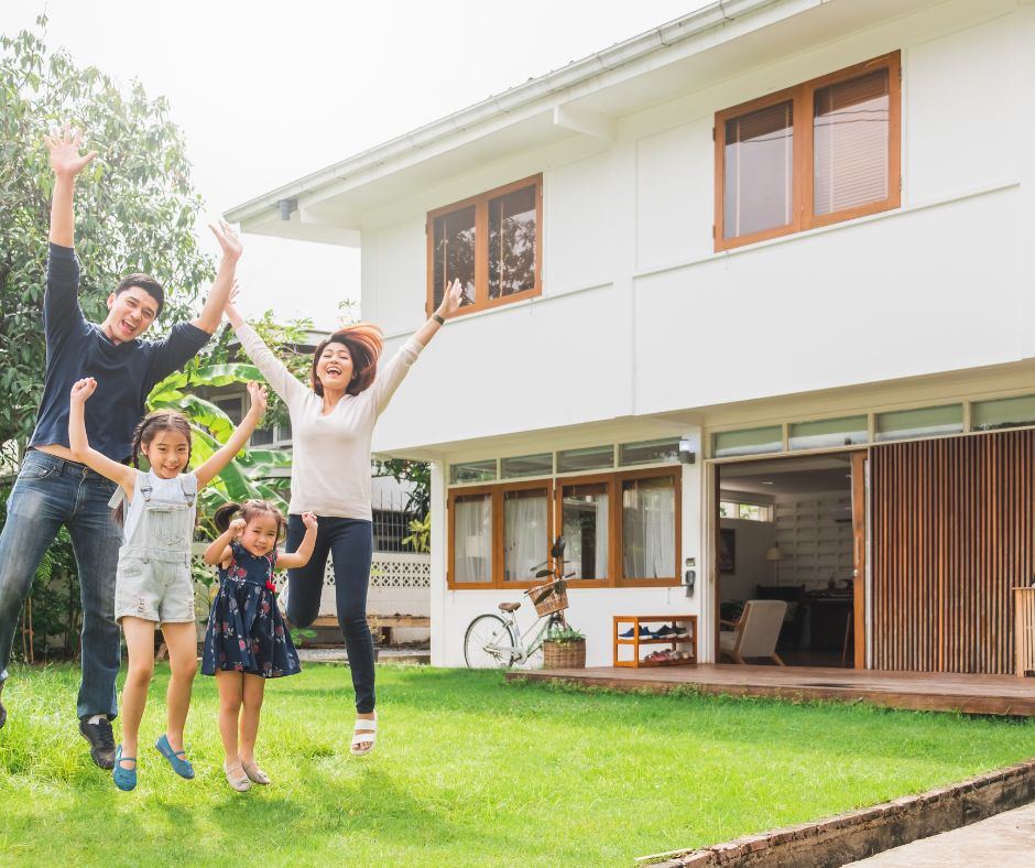 family infront of house