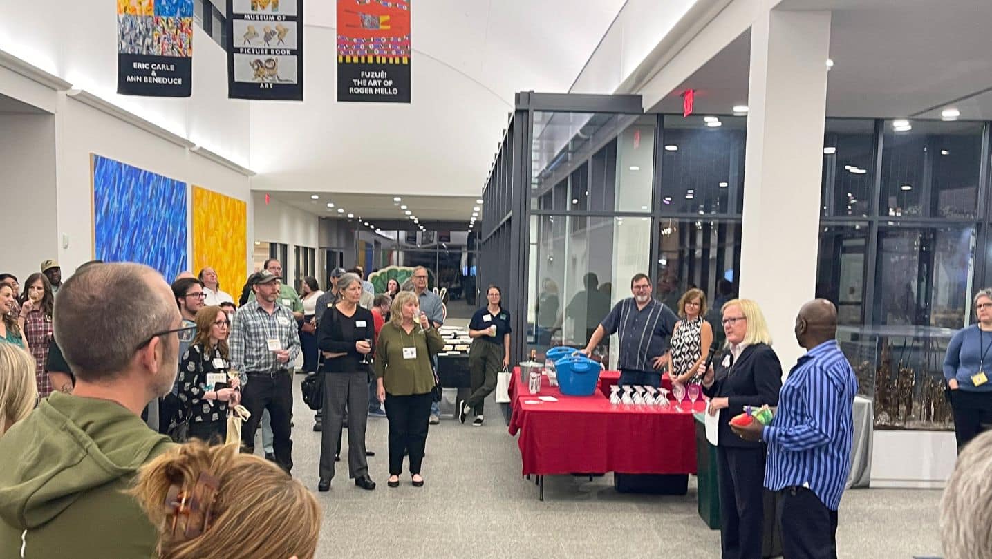 Debra Rogers, Interim President and Chief Operating Officer of Cooley Dickinson Hospital speaks at a Northampton Chamber networking event held at the Eric Carle Museum of Picture Book Art.