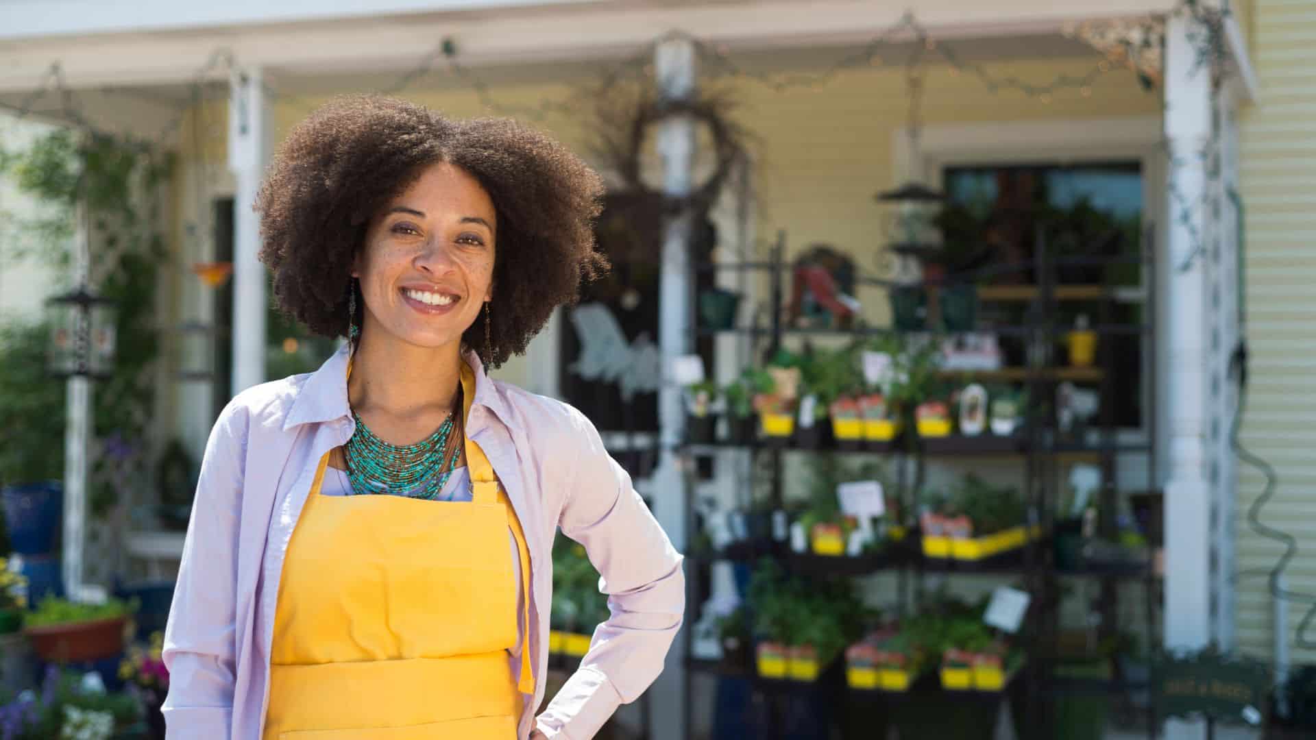 Woman smiling after she opened her small business.