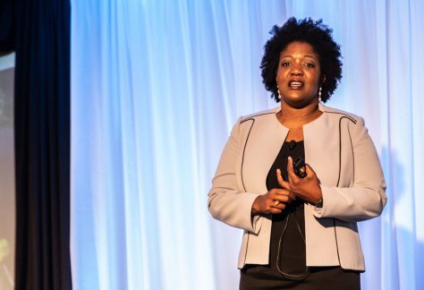 Kisha Zullo speaking on stage